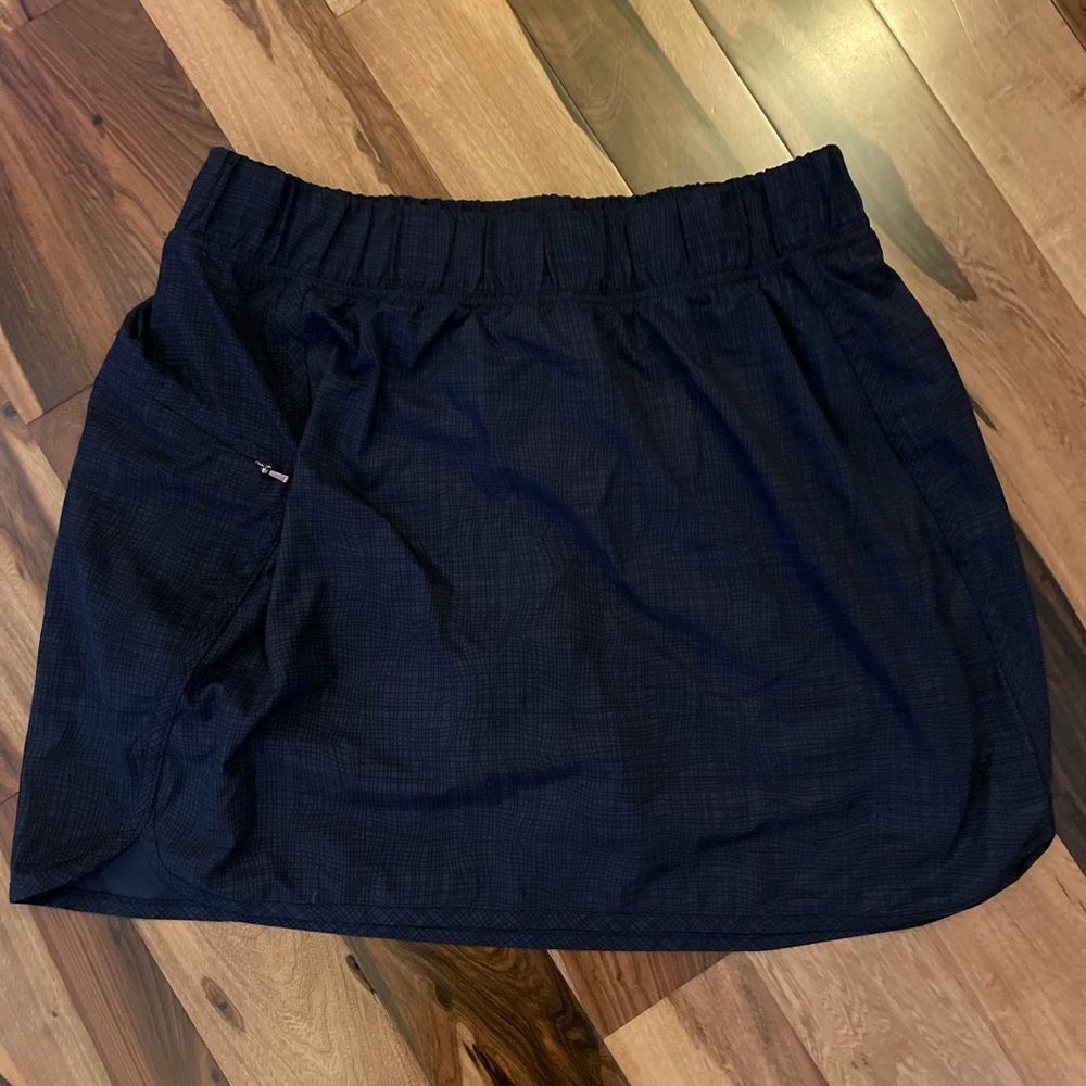 Blue skort with a zip pocket.
